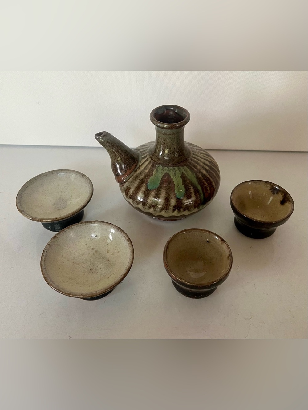 Ceramic Sake Bottle with Spout and 4 cups.